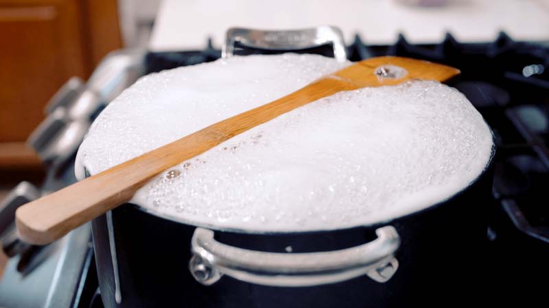 Prevent Boiling Over With A Wooden Spoon 