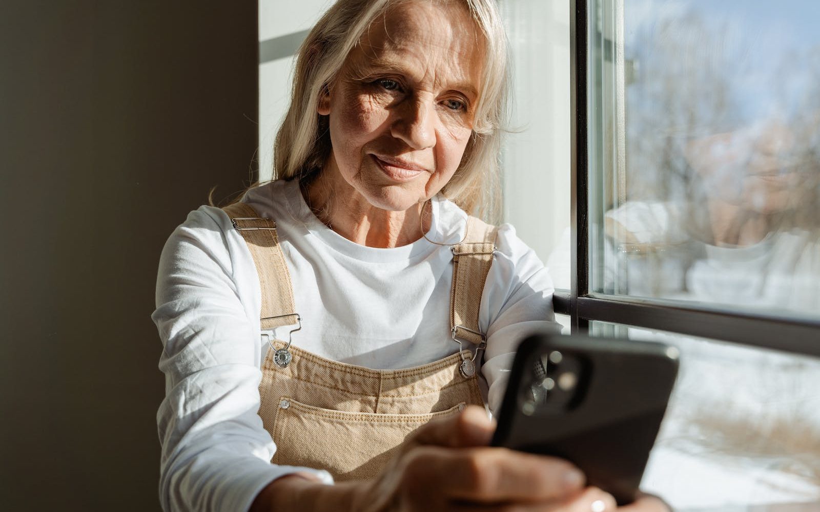 Woman Holding a Smartphone