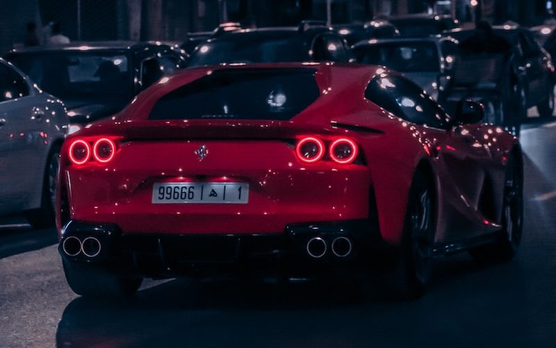 red porsche 911 parked on road during night time