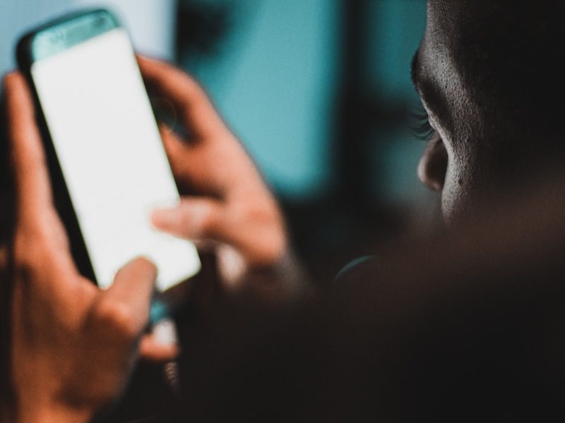 person holding black Android smartphone