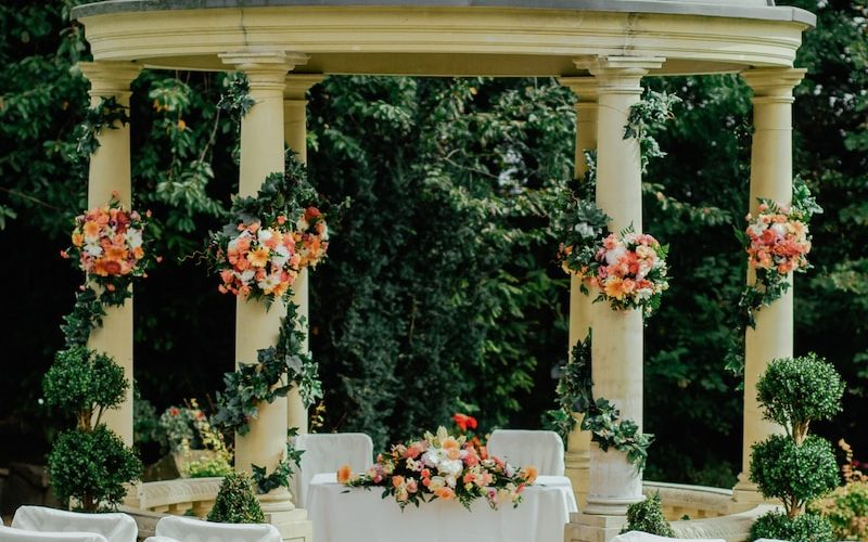 gray and beige gazebo near green leafed tree